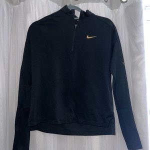Nike dry fit, quarter zip, black and rose gold with Nike logo on sleeves